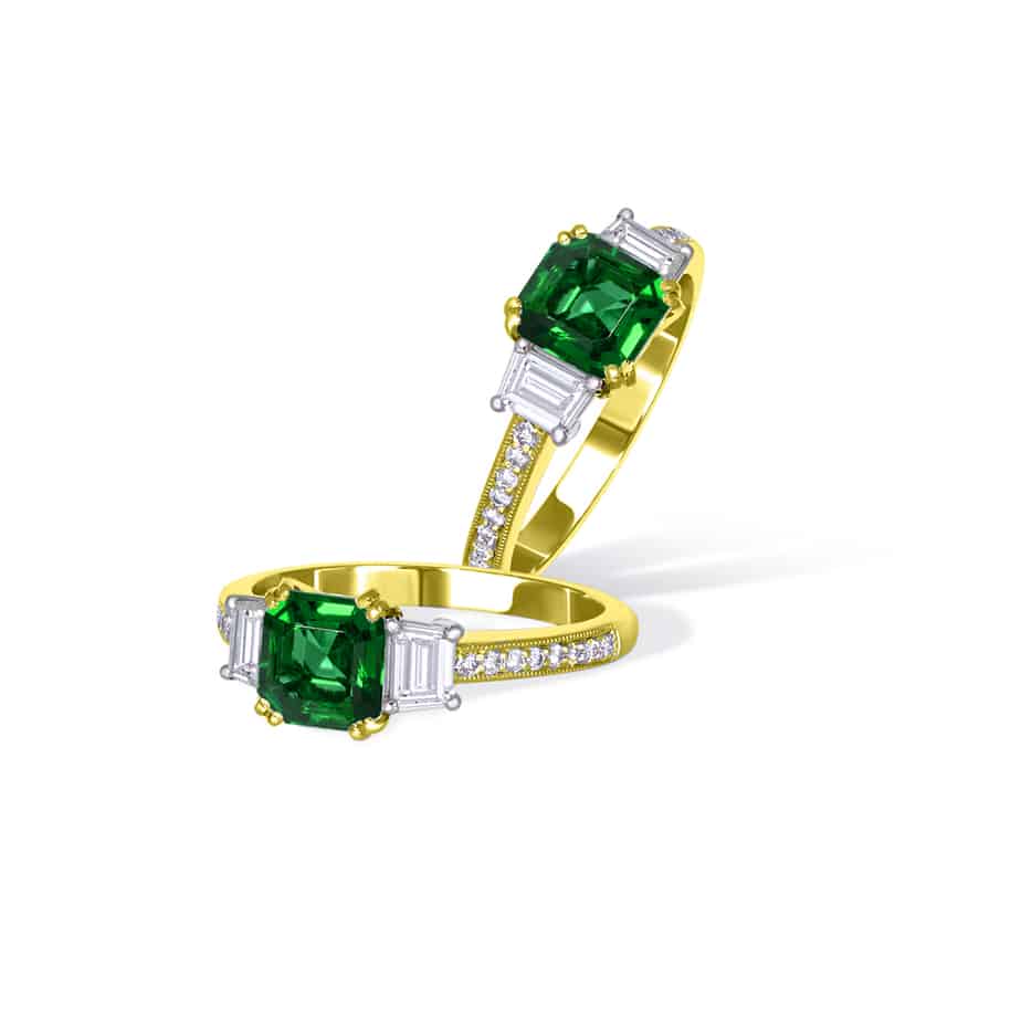 Emerald cut emerald and trapeze diamond ring