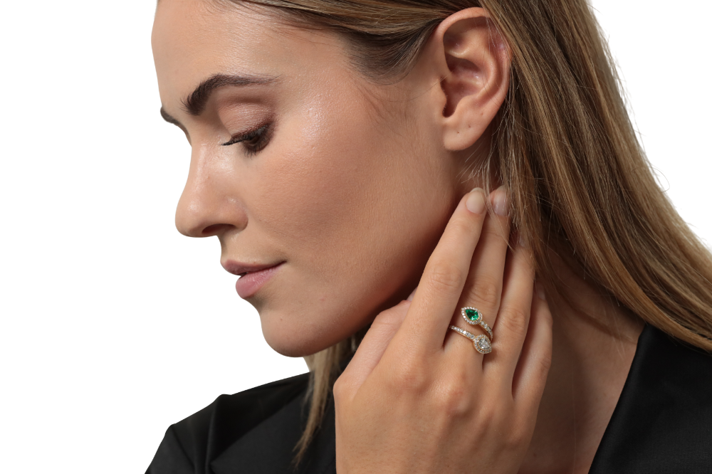 Emerald and diamond crossover ring