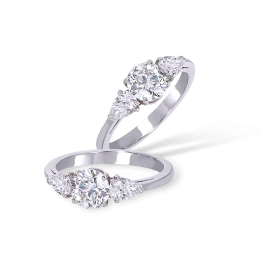 Round and pear shape diamond ring