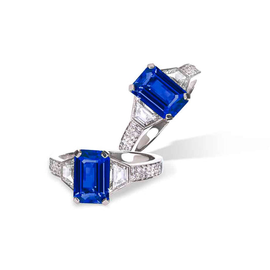 Emerald cut sapphire and trapeze diamond 3 stone ring