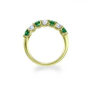 Claw set emerald and diamond half eternity ring