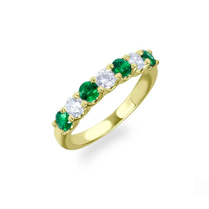 Claw set emerald and diamond half eternity ring