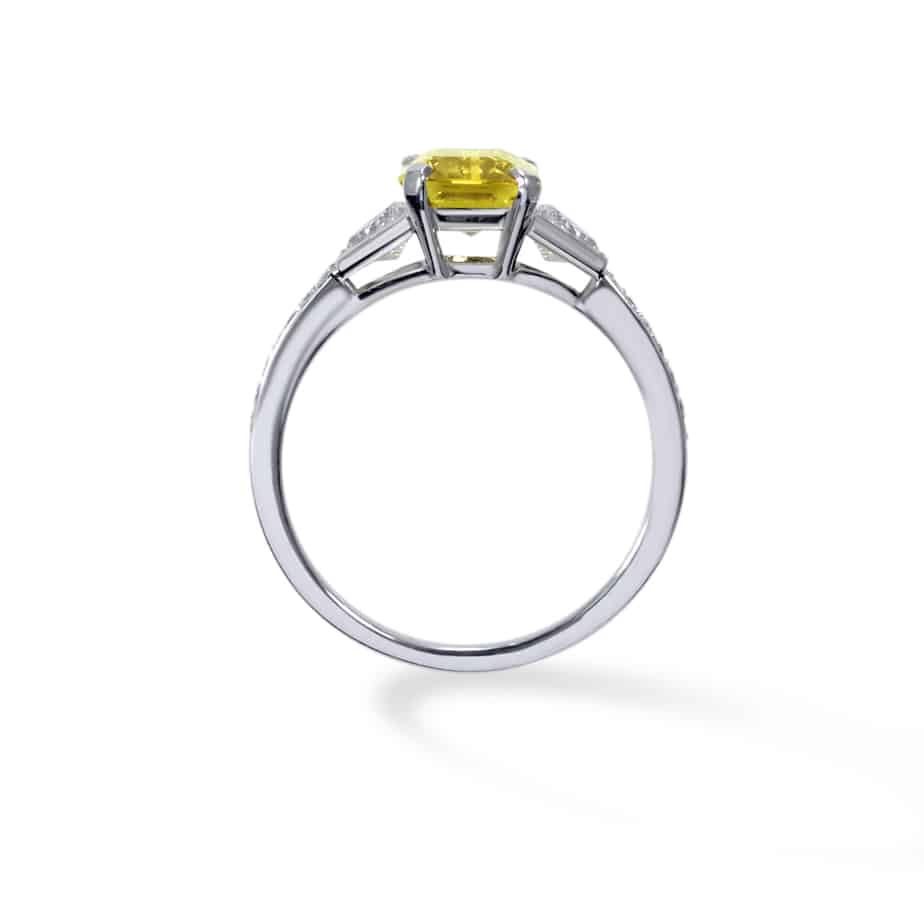 Emerald cut yellow sapphire and trapeze cut diamond 3 stone ring