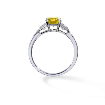 Emerald cut yellow sapphire and trapeze cut diamond 3 stone ring