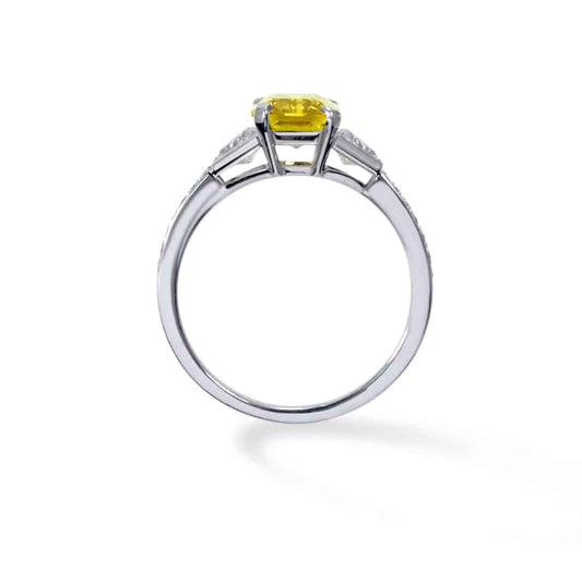 Emerald cut yellow sapphire and trapeze cut diamond 3 stone ring