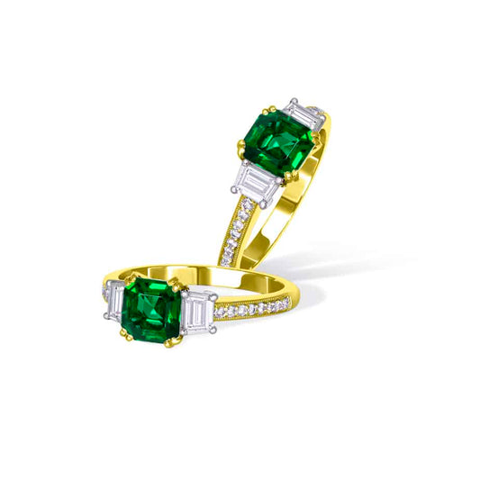 Emerald cut emerald and trapeze diamond ring