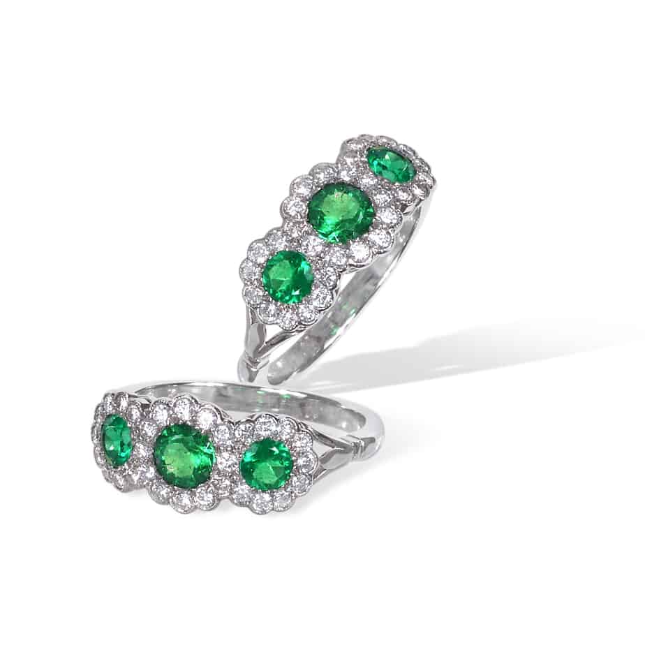 Round emerald and diamond triple cluster ring
