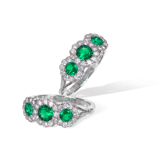 Round emerald and diamond triple cluster ring