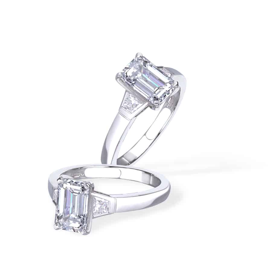 Emerald and trapeze diamond ring