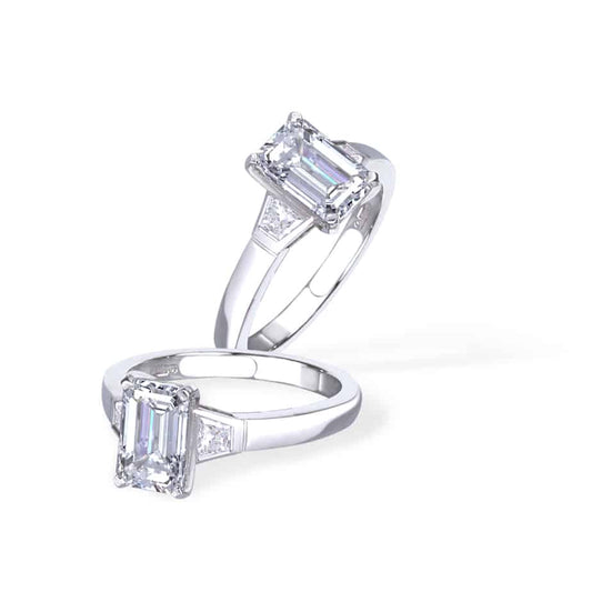 Emerald and trapeze diamond ring