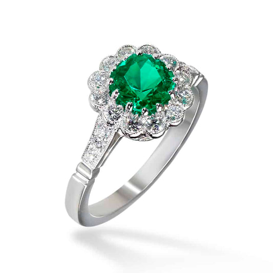 Cushion cut emerald and diamond cluster ring