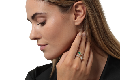 Emerald and diamond crossover ring