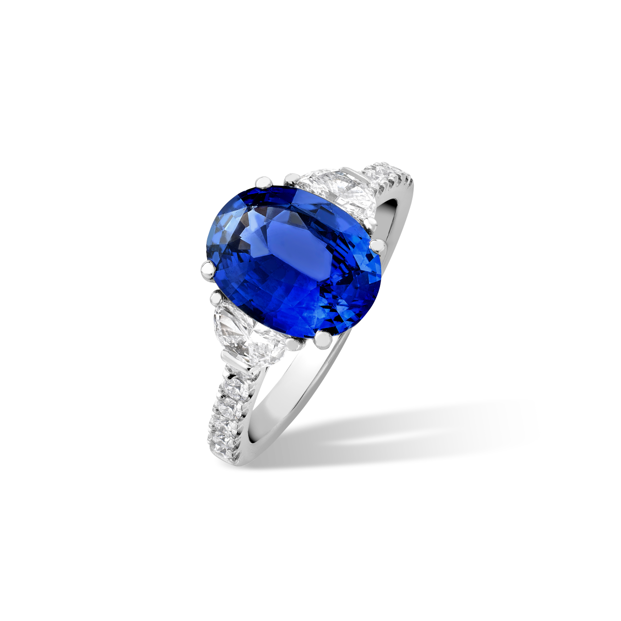 Oval sapphire and half moon diamond ring