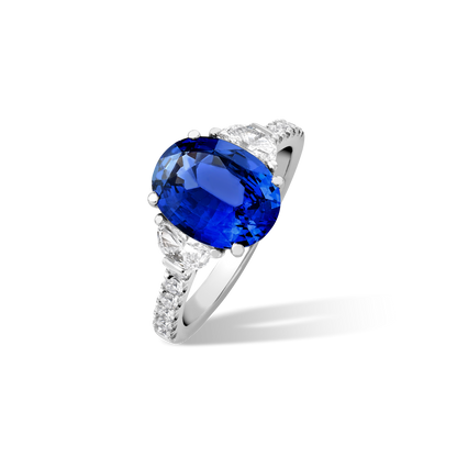 Oval sapphire and half moon diamond ring