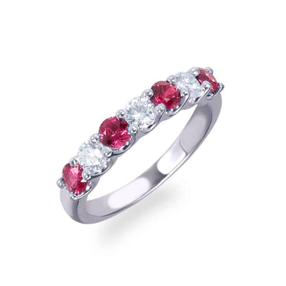 Claw set ruby and diamond half eternity ring