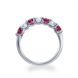 Claw set ruby and diamond half eternity ring