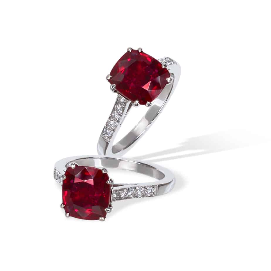 Cushion cut ruby and diamond single stone ring