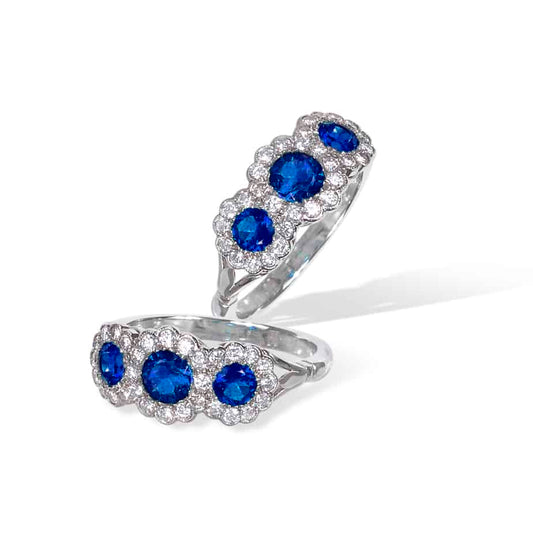 Round sapphire and diamond triple cluster ring
