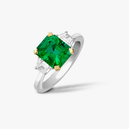 Octagon emerald and trapeze diamond 3 stone ring