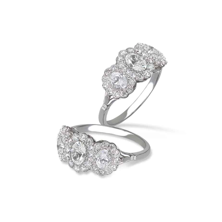 Oval diamond triple cluster ring