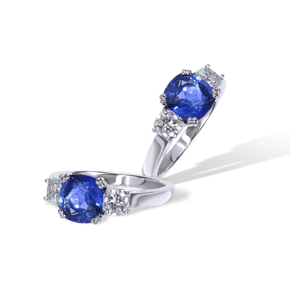 Cushion cut sapphire and diamond 3 stone ring
