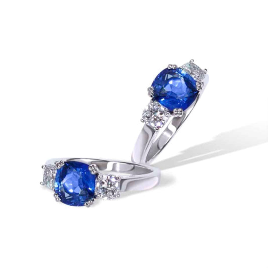 Cushion cut sapphire and diamond 3 stone ring