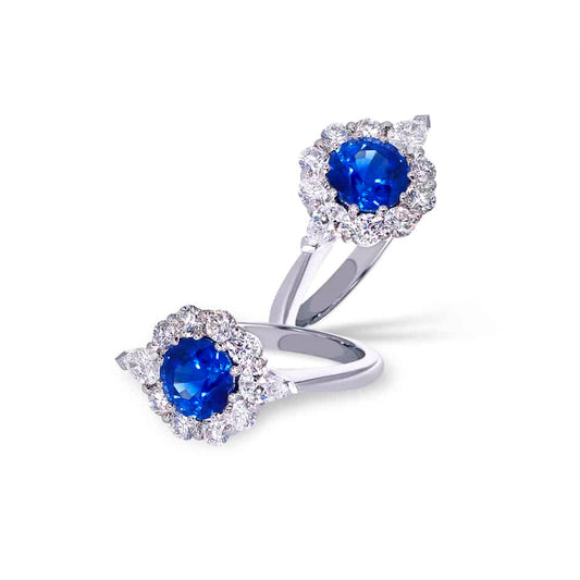 Round sapphire & diamond cluster ring