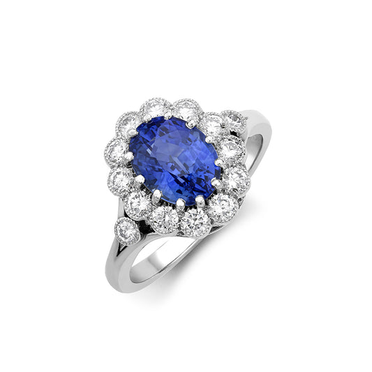 Oval sapphire and diamond cluster ring