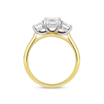 Emerald cut diamond three stone ring in 18ct yellow gold and platinum, side view