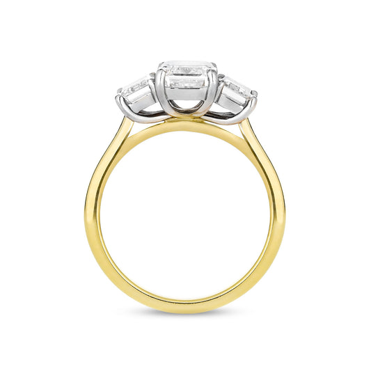 Emerald cut diamond three stone ring in 18ct yellow gold and platinum, side view