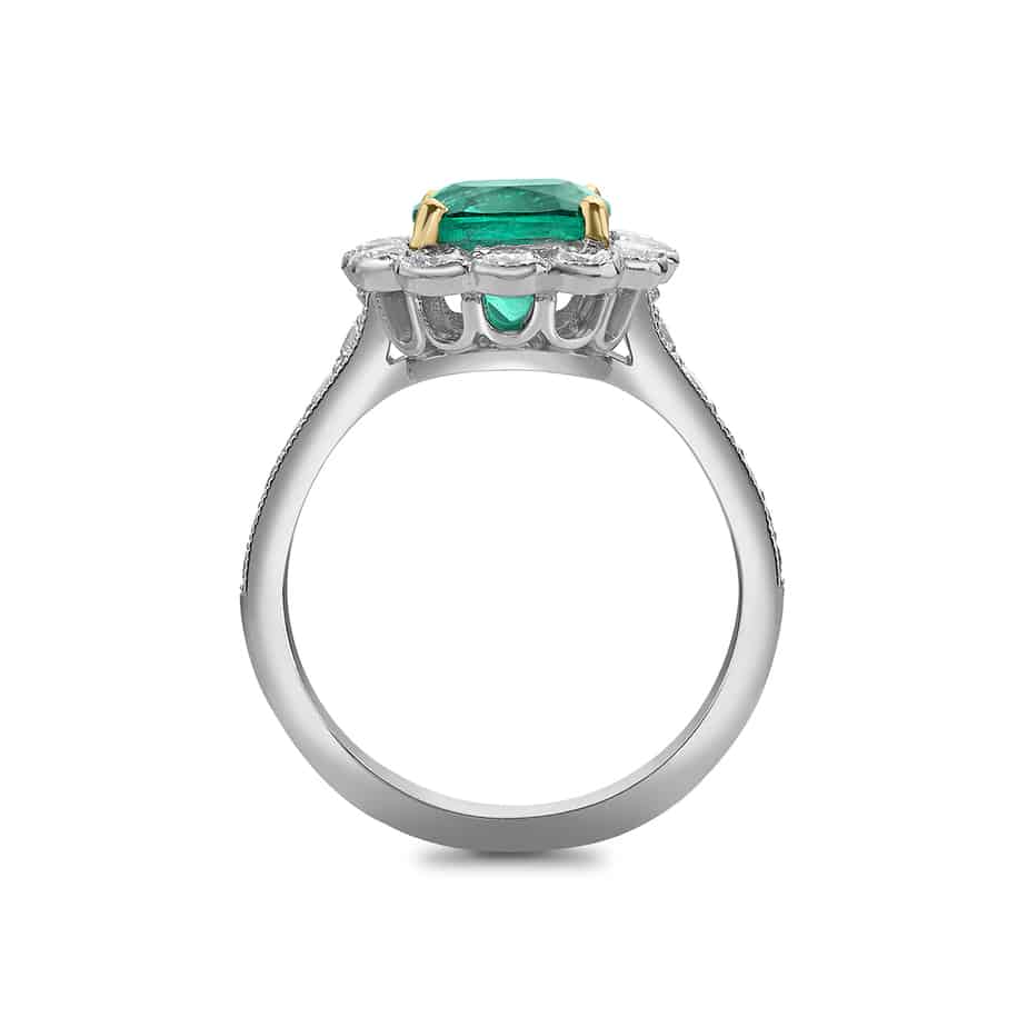 Cushion cut emerald and diamond cluster ring