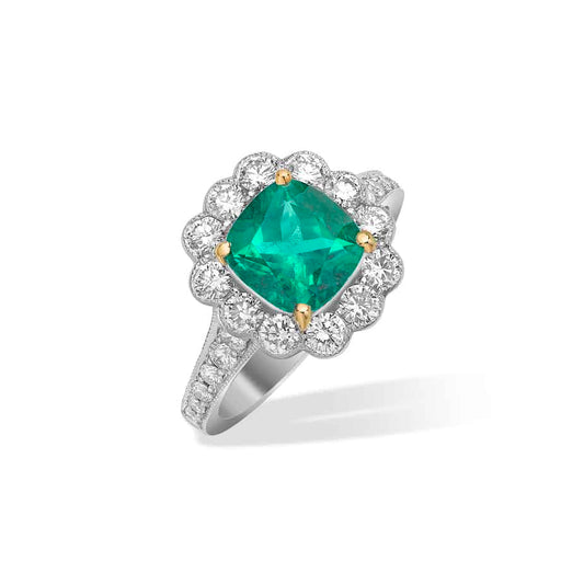 Cushion cut emerald and diamond cluster ring