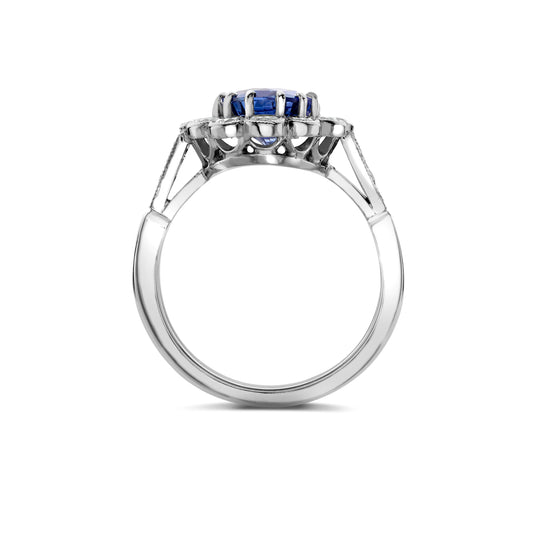 Oval sapphire and diamond cluster ring