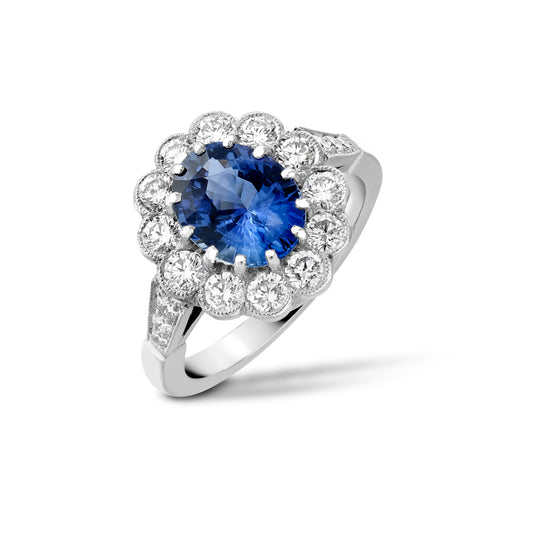 Oval sapphire and diamond cluster ring